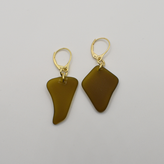 Salty Dreamers’ Earrings | Seaglass Brownie: Handmade gold leverback earrings featuring irregular, translucent brown glass pendants, displayed on a plain white background.