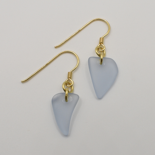 Salty Dreamers' Earrings | Seaglass Small Blue feature handmade, irregular blue seaglass pendants on gold-plated silver hooks, shown against a white background.