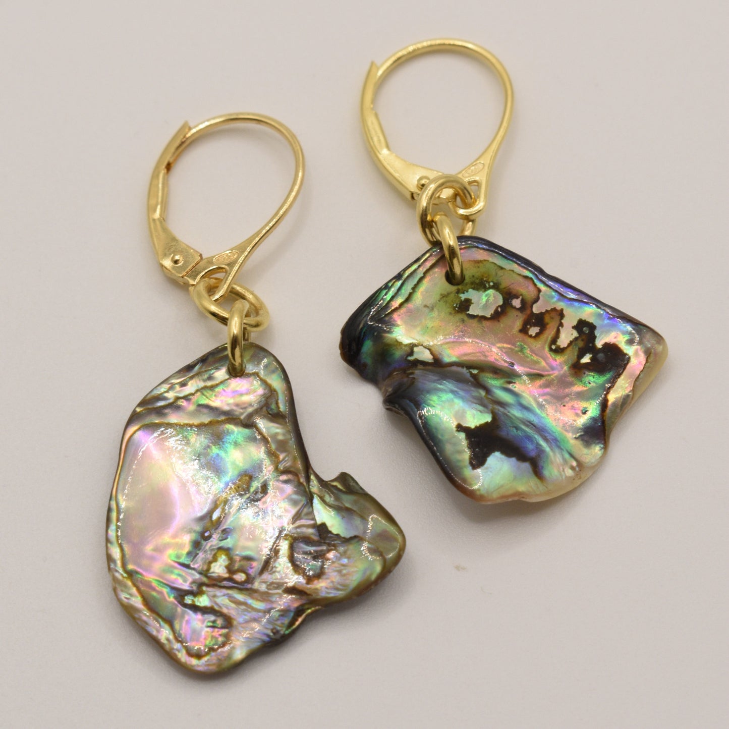 Salty Dreamers’ Earrings | Paua Shell Aroha feature handmade, gold plated silver leverbacks with unique, iridescent abalone shell pendants for a vibrant, multicolored look.