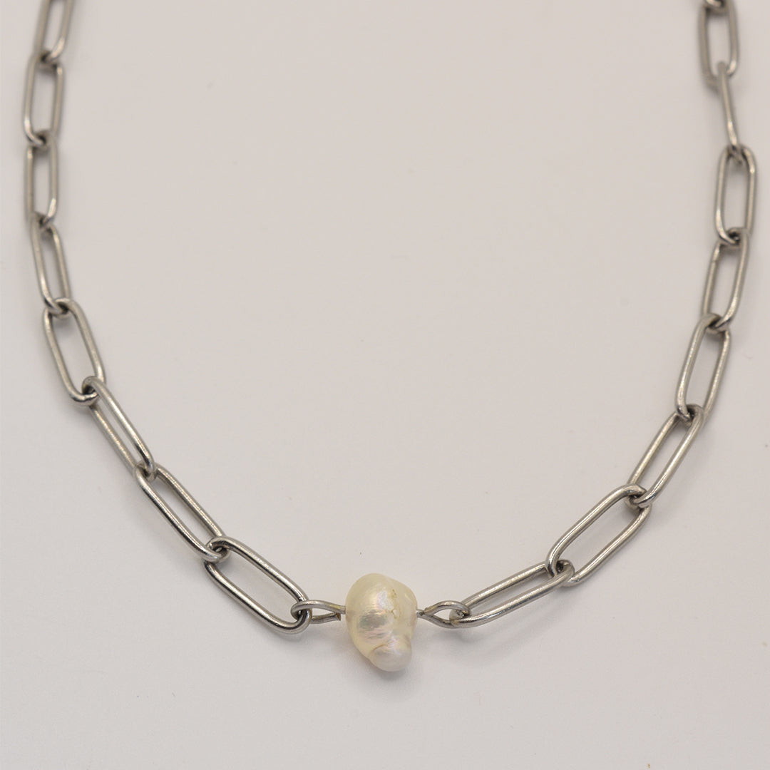 The Salty Dreamers Necklace | Paperclip Cutie Silver features large silver oval links and a single irregular freshwater pearl pendant, shown on a plain light background.