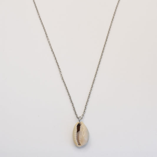 The Necklace | Simplified Cowrie Silver by Salty Dreamers features a handmade silver chain with a single cowrie pendant, beautifully displayed against a plain white background.