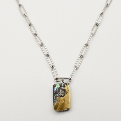 Necklace with a rectangular pendant on a light gray background