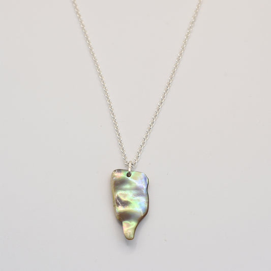 The Salty Dreamers Necklace | Paua Shell Ruru is a handmade sterling silver piece featuring an iridescent pāua shell pendant with a smooth, organic shape, shown on a plain white background.