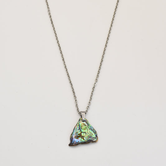The Salty Dreamers Necklace | Paua Shell Ngaru is a handmade piece featuring a small, iridescent pāua shell pendant that shimmers beautifully.