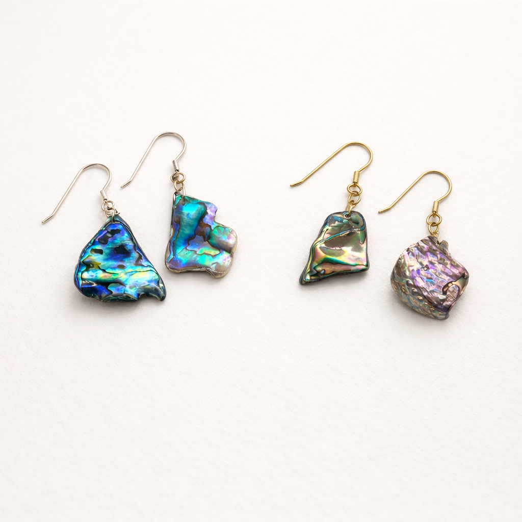 Add a splash of color to your style with Salty Dreamers' Earrings | Paua Shell Surprise—four 925 silver dangle earrings featuring unique, iridescent paua shell pendants in blue, green, and purple hues. Perfect for your jewellery bag!.