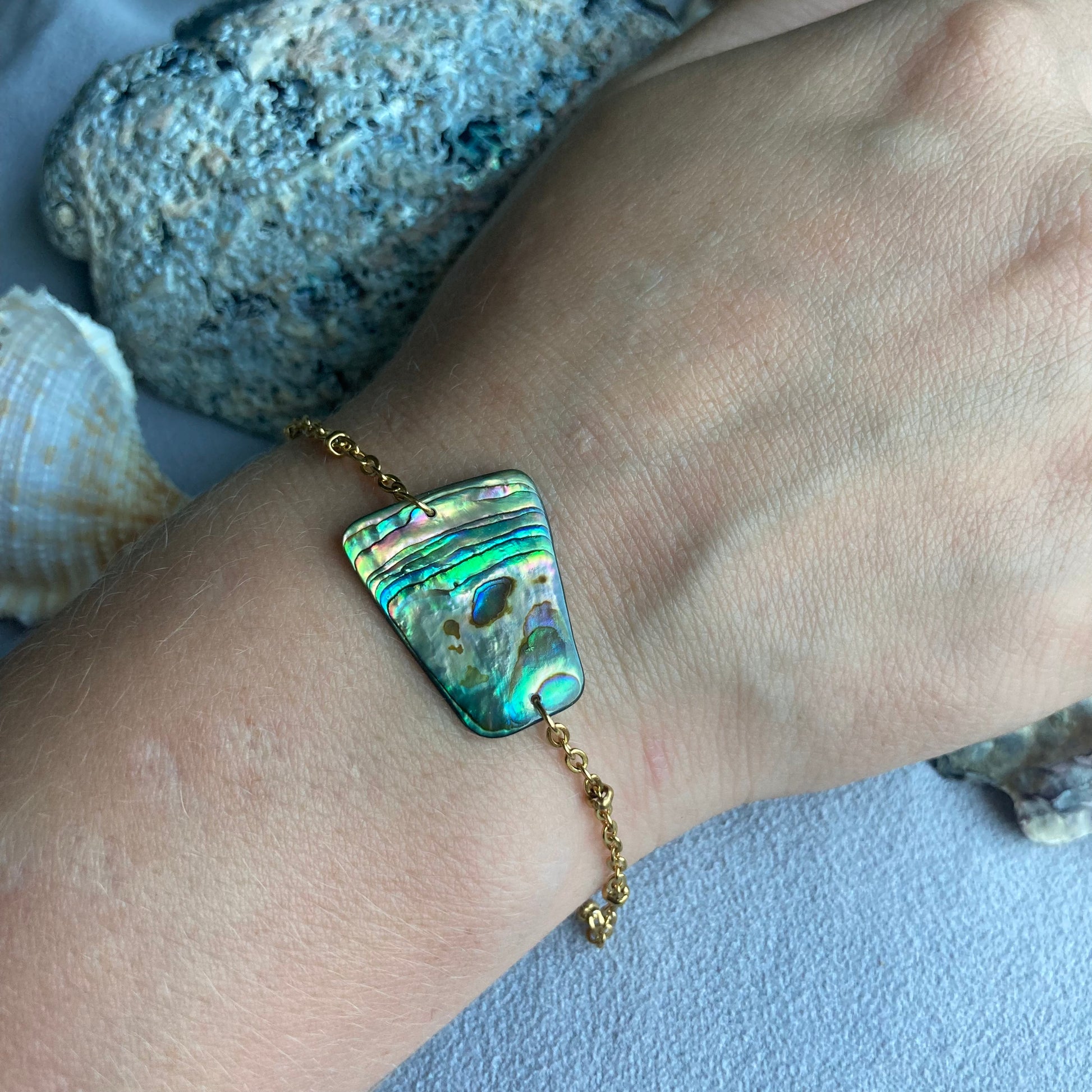 golden abalone bracelet on wrist